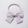 Detail of baby nylon headband with khaki striped bow featuring soft elastic material - Khaki & White Stripes