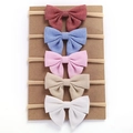 Five-piece baby headband set with soft fabric bows in various colors on nylon bands - Multicolor