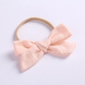 Detail of light pink linen cotton bow headband with high elasticity nylon for baby girls - Light Pink