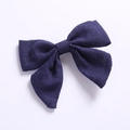 Detailed texture of a navy linen swallowtail bow hair clip for girls' accessories - Navy Blue