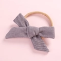 Detail of baby purple corduroy bow headband featuring high-elastic nylon band - Gray