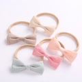 Set of 5 cotton bow baby headbands in soft neutral tones with white cross patterns - Random Mixed Colors