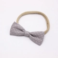 Elastic baby headband featuring a grey fabric bow with white star patterns - 6 Gray