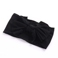 Detailed top view of black handmade bow headband on soft elastic nylon fabric material - Black