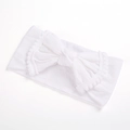 Detailed close-up of a white baby headband featuring a large pom-pom trimmed bow - White