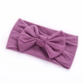 Close-up of soft purple nylon baby headband with a textured knitted large bow knot - Light Purple