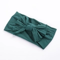 Detailed texture of dark green soft nylon baby headband with a double-layered bow knot - Dark Green