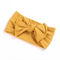 Elastic baby headband with wide soft bow in ginger yellow knit fabric for infants - Turmeric