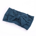 Close-up of dark blue elastic bow headband for infants showing soft fabric texture - Ink Blue
