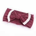 Elastic burgundy baby headband with large bow and white pom-pom trim detail - Wine Red