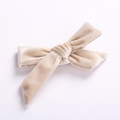 Classic cream velvet bow hair clip for girls with a soft silk sheen and matte finish - Off White