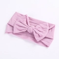 Detailed close-up of soft lavender knitted nylon baby headband with a large bow design - Taro Purple