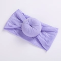 Detail view of light purple nylon donut headband with soft pleated circular knot decoration - Purple