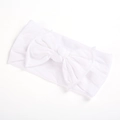 Macro shot of white soft nylon baby headband with a handcrafted oversized bow detail - White