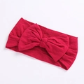 Detail of red oversized bow headband made of high-stretch soft knit cotton fabric for infants - Dark Red
