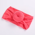 Detailed view of sweet donut nylon elastic baby headband in bright coral pink - Watermelon red