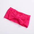 Dettaglio fascia per neonati magenta con fiocco grande e frange decorative con pompon - Rosa Rossa