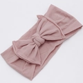 Detail of baby headband with a large layered bow in soft dusty pink knitted fabric - Deep Pink