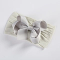 Detail showing high-elasticity soft nylon band and a large grey textured grosgrain bow - Off-White