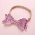 Detail of pink sequin bow on ultra-soft nude nylon headband for infants and toddlers - Light Purple
