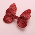 Detailed view of 3D glittery butterfly hair clip wings in a vibrant red sparkling finish - Red