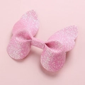 Detailed macro view of a pink glittery 3D butterfly hair clip with sequin texture - Light Pink