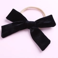 Detail of soft black velvet bow headband for girls featuring high-elastic nylon band - Black