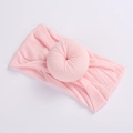 Soft light pink nylon baby headband featuring a flexible donut knot design - 22 Light Pink