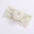 Elastic cream white nylon headband for babies featuring a soft doughnut knot decoration - 24 Off White