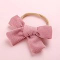Bandeau bébé avec gros nœud en velours côtelé rose et bandeau en nylon élastique - Rouge Brique