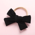 Détail du bandeau en nylon extensible avec un nœud en velours côtelé noir pour bébé - Noir