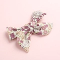 Detail of floral print baby hair clip with soft purple leaves on cotton fabric bow - Purple Floral