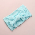 Detailed macro view of soft light blue jacquard nylon baby headband with a large bow - Sky Blue