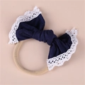 Detail of navy blue bow headband with white lace trim and elastic nylon band - Navy Blue