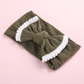 Close-up of olive green cable knit baby headband with bow and white pom-pom trim - Military Green/White