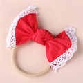 Detail of red baby headband featuring soft lace edges and a handmade knit cotton bow - Red