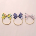 Three-piece floral baby bow headbands featuring strawberry and floral cotton patterns - Random Mixed