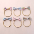 Lot de 6 bandeaux bébé avec nœuds floraux en nylon élastique aux motifs printaniers doux - Style de Combinaison Multicolore (Mélange Aléatoire)