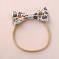 Fascia per neonati con fiocco floreale colorato ed elastico in nylon beige - Stile Floreale Viola (1)