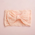 Detailed view of pink baby nylon headband featuring textured dots and double layer bow - Dark Pink