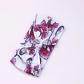 Dettaglio fascia neonata in nylon con stampa floreale senza cuciture e fiocco decorativo - Ipomoea
