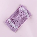 Close-up of baby nylon headband with light purple bow and delicate white lace edges - Taro Purple