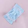 Detail of baby headband featuring light blue bow and delicate white lace floral edges - Sky Blue