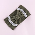 Close-up of olive green baby headband with white lace trim and bow on pink background - Army Green