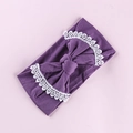 Detail of dark purple baby headband featuring large bow and white lace floral trim - Light Purple