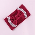 Detailed view of burgundy baby headband with large bow and white lace embroidered edges - Dark Red