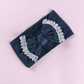 Detailed view of dark blue nylon baby headband with white lace embroidered bow accent - Dark Blue