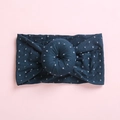 Macro detail of navy donut knot headband with silver grid pattern on soft fabric - Dark Blue