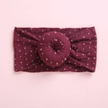 Detailed view of the soft burgundy knit fabric with white square patterns and donut knot - Burgundy