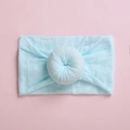Macro shot of light blue baby headband featuring soft fabric texture and donut knot detail - Sky Blue